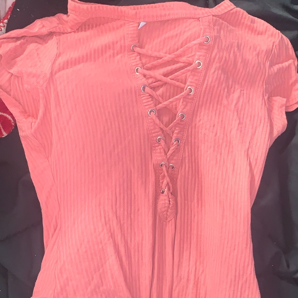 Pink cross laced body suit